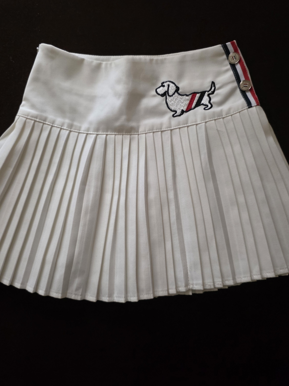 White Pleated Mini Skirt with Embroidered Dachshund Accent